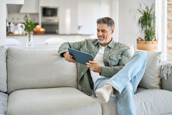 man working on the couch